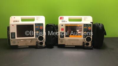 2 x Medtronic Physio-Control Lifepak 12 Biphasic 12 Lead Defibrillators / Monitors with CO2, SPO2, NIBP, ECG and Printer Options and 1 x Battery (Both Power Up, Both Missing / Damaged Casing - See Photos) *37628578 / 37628599*