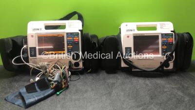 2 x Physio-Control Lifepak 12 Biphasic 12 Lead Defibrillators / Monitors with CO2, SPO2, NIBP, ECG and Printer Options, 1 x SpO2 Finger Sensor, 1 x NIBP Hose and BP Cuff, 1 x 4 Lead ECG Lead and 1 x Battery (Both Power Up with Stock Batteries, 1 x Battery