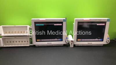 2 x Philips IntelliVue MP70 Anesthesia Patient Monitors with 1 x Philips M3001A Patient Module with ECG/Resp, SpO2, NBP, Press/Temp Options *Mfd 2013* and 2 x Philips M8048A Module Racks (Both Power Up with 1 x Missing Dial)