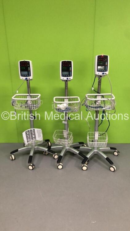 3 x Mindray VS-800 Patient Monitors on Stands with 3 x BP Hoses and 3 x SpO2 Finger Sensors (All Power Up-2 x Missing Light Lens-See Photos) * SN BY-12125150 / BY-12125149 / BY-12125156 *