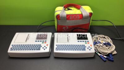 2 x Schiller AT-101 EKG Machines with 1 x Lead and 1 x Carry Bag (Both Draw Power with Blank Screens)