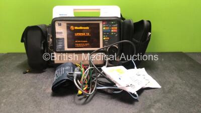 Medtronic Physio Control Lifepak 12 Biphasic Defibrillator / Monitor Including ECG, SpO2, NIBP and Printer Options with 1 x Physio Control Ref 11111-000019 4 Lead ECG Lead, 1 x Trunk Lead , and 1 x SpO2 Finger Sensor and 2 x Defibrillation Pads in Carry 