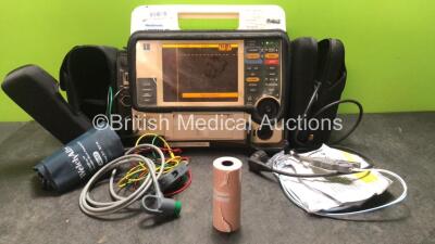 Medtronic Physio Control Lifepak 12 Biphasic Defibrillator / Monitor Including Pacer, ECG, CO2 SpO2, NIBP and Printer Options with 1 x Physio Control Ref 11111-000019 4 Lead ECG Lead, 1 x Trunk Lead , 1 x Printer Reem, 1 x NIBP Hose and 1 x BP Cuff in Car