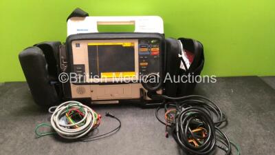 Medtronic Physio Control Lifepak 12 Biphasic Defibrillator / Monitor Including ECG, SpO2, NIBP and Printer Options with 1 x Physio Control Ref 11111-000019 4 Lead ECG Lead, 1 x Trunk Lead , and 1 x Medtronic 4 Lead ECG Lead in Carry Case (Powers Up-Batter