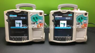 2 x Philips Heartstart MRx Defibrillator Including Pacer, ECG and Printer Options with 2 x Philips M3539A Power Adapter and 2 x Philips M3538A Batteries (Both Power Up)