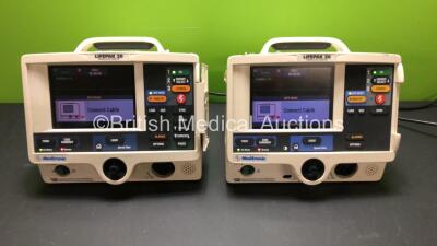 2 x Lifepak 20 Defibrillators / Monitors *Mfd 2002 - 2002* Including ECG, 1 x Pacer and Printer Options (Both Power Up with Service Lights) *30755140 - 30713864*