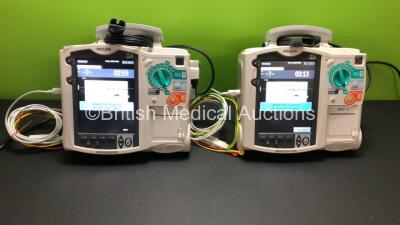 2 x Philips HeartStart MRx Defibrillators with 2 x Pacer, 2 x ECG and 2 x Printer Options with 2 x M3539A Modules, 2 x ECG Leads, 2 x Paddle Leads *Mfd 2015 - 2010* (Both Power Up) *US00546525 - US00584761*