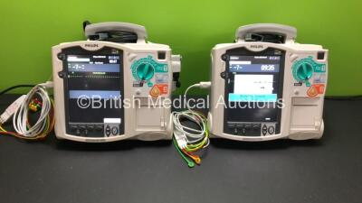 2 x Philips HeartStart MRx Defibrillators with 2 x ECG and 2 x Printer Options with 2 x M3539A Modules, 2 x ECG Leads, 2 x Paddle Leads *Mfd 2010 - 2010* (Both Power Up) *US00546554 - US00546519*