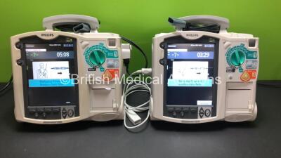 2 x Philips HeartStart MRx Defibrillators with 1 x Pacer, 2 x ECG Options, 2 x Paddle Leads and 1 x ECG Lead *Mfd 2015 - 2007* (Both Power Up Using Stock Modules - Not Included) *US00583363 - US00315169*