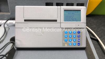 Mixed Lot Including 1 x Micro Medical Spirometer in Case with 1 x AC Power Supply (Powers Up) 1 x Onward Design Patient Transfer Board, 2 x Welch Allyn 767 Series Wall Mounted Ophthalmoscopes with 4 x Attachments (Both Power Up) - 2