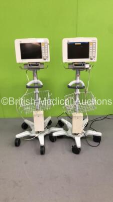 2 x Drager Infinity Delta Patient Monitors with HemoMed1 NIBP, Aux/Hemo3 and MultiMed Options, Docking Stations and Power Supplies on Stands (Both Power Up, 1 with Blank Screen and Damaged Casing - See Photo) *6000484275 / 4000478077*