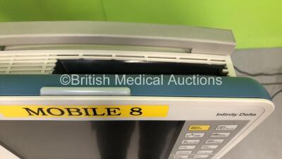 3 x Drager Infinity Delta Patient Monitors with HemoMed1, NIBP, Aux/Hemo3 and MultiMed Options, 2 x 5 Lead ECG Leads, 2 x 3 Lead ECG Leads, 2 x SPO2 Finger Sensors, 3 x Docking Stations and 3 x Power Supplies on Stands (All Power Up, 2 with Damaged Casing - 8