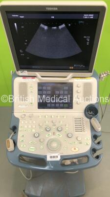 Toshiba Xario XG Flat Screen Ultrasound Scanner Model SSA-680A with 2 x Transducers/Probes (1 x PVT-375BT * Mfd Jan 2019 * and 1 x PLT-604AT * Mfd Jan 2013 *) (Powers Up-110V-Adapter Not Included-General Marks to Side Panels) * SN 99F1033876 * * Mfd March - 2