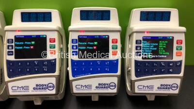 8 x CME Bodyguard 323 Infusion Pumps and 10 x Charger-Docking Stations (All Power Up) - 2