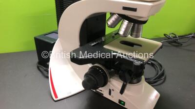 Leica DM2500 Bench Binocular Microscope (Powers Up) with 2 x HC PLAN s 10x 22 Eyepieces, 5 x Optics Including 1 x HCX PL FLUOTAR 100x 1.30 OIL, 1 x 40x 0.75, 1 x 10x 0.30, 1 x 5x 0.15, 20x 0.50, 1 x 1.25x 0.04 and 1 x Leica DFC420 Digital Camera - 2