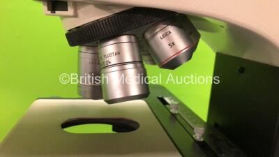 Leica DM2500 Bench Binocular Microscope (Powers Up) with 2 x HC PLAN s 10x 22 Eyepieces, 5 x Optics Including 1 x HCX PL FLUOTAR 100x 1.30 OIL, 1 x 40x 0.75, 1 x 10x 0.30, 1 x 5x 0.15, 20x 0.50, 1 x 1.25x 0.04 and 1 x Leica DFC420 Digital Camera - 5