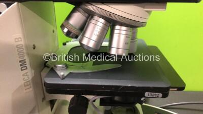 Leica DM4000 B Bench Binocular Microscope (Powers Up) with 2 x HC PLAN s 10x 22 M Eyepieces, 7 x Leica Optics Including 1 x HCX PL FLUOTAR 1.25x 0.04, 1 x 40x 0.75, 1 x 5x 0.15, 1 x HC PL APO 10x 0.40, N PLAN 63x 0.80, HC PLAN APO 20x 0.70, 1 x PL FLUOTAR - 5