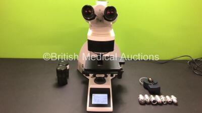 Leica DM4000 B Bench Binocular Microscope (Powers Up) with 2 x HC PLAN s 10x 25 M Eyepieces, 7 x Leica Optics Including 1 x HCX PL FLUOTAR 1.25x 0.04, 1 x 2.5x 0.07, 1 x 5x 0.15, 1 x HC PL APO 10x 0.40, N PLAN 63x 0.80, HC PLAN APO 20x 0.70, 1 x HCX PL AP