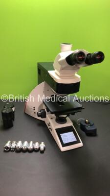 Leica DM4000 B Bench Binocular Microscope (Powers Up) with 2 x HC PLAN s 10x 25 M Eyepieces, 7 x Leica Optics Including 1 x HCX PL FLUOTAR 1.25x 0.04, 1 x 2.5x 0.07, 1 x 5x 0.15, 1 x HC PL APO 10x 0.40, N PLAN 63x 0.80, HC PLAN APO 20x 0.70, 1 x HCX PL AP - 3