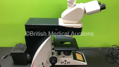 Leica DM4000 B Bench Binocular Microscope (Powers Up) with 2 x HC PLAN s 10x 25 M Eyepieces, 7 x Leica Optics Including 1 x HCX PL FLUOTAR 1.25x 0.04, 1 x 2.5x 0.07, 1 x 5x 0.15, 1 x HC PL APO 10x 0.40, N PLAN 63x 0.80, HC PLAN APO 20x 0.70, 1 x HCX PL AP - 8