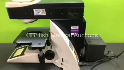 Leica DM4000 B Bench Binocular Microscope (Powers Up) with 2 x HC PLAN s 10x 25 M Eyepieces, 7 x Leica Optics Including 1 x HCX PL FLUOTAR 1.25x 0.04, 1 x 2.5x 0.07, 1 x 5x 0.15, 1 x HC PL APO 10x 0.40, N PLAN 63x 0.80, HC PLAN APO 20x 0.70, 1 x HCX PL AP - 9