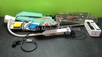 Mixed Lot Including 1 x Giraffe Exam Light (No Power) 1 x Arjohuntleigh KTA0102 Battery *Untested* 1 x Olympus Type Celon Footswitch, 1 x Sonicaid TOCO Transducer / Probe, 1 x Surgical Instrument Tray with 2 x Syringes and 1 x Arjohuntleigh Sling