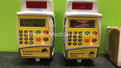 Mixed Lot Including 2 x Mckinley Bodyguard 545 Epidural Pumps (Both Power Up, 1 with Damaged Screen-See Photo) 1 x Philips IntelliVue X2 Handheld Patient Monitor *Spares and Repairs* - 2