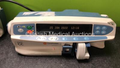 Job Lot of Pumps Including 1 x Alaris Asena GS Volumetric Pump (Holds Power, Blank Display) 3 x Cardinal Health Alaris GH Syringe Pumps (2 Hold Power with Blank Screens, 1 No Power) 1 x Carefusion Alaris CC Syringe Pump (Powers Up) 1 x Alaris IVAC Pump (N - 2