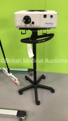 Mixed Lot Including 1 x Luxtec Model 9300XSP Light Source on Stand and 1 x Liko Golvo 7007 ES Electric Patient Hoist with Controller (1 x No Power,1 x Unable to Power Test Due to No Battery) * SN 7722808 / 110709 * - 2