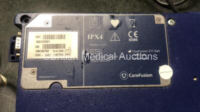 Mixed Lot Including 2 x Alaris SE Pumps (Both Power Up with Error-See Photo) 1 x IVAC PCAM Pump (Untested Due to Damaged Power Port-See Photo) 1 x Handheld Capnocheck II with AC Power Supply (Powers Up) 3 x Philips Respironics System One CPAP Units (All P - 5