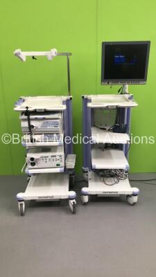 2 x Olympus Stack Trolleys with Olympus OEV191H Monitor, Olympus Evis Lucera CV-260 Digital Processor, Olympus Evis Lucera CLV-260 Light Source, Olympus MAJ-1154 Pigtail Connector and Pentax EPK-1000 Video Processor (Powers Up - Missing Rear Cover on 1 x 