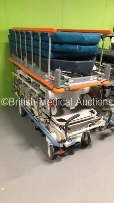 2 x Hill Rom Transtar Hydraulic Patient Trolleys with Mattresses, 1 x Linet Sprint Patient Transport Trolley with Mattress and 1 x Stryker Transport Patient Trolley with Mattress - 2