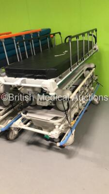 2 x Hill Rom Transtar Hydraulic Patient Trolleys with Mattresses, 1 x Linet Sprint Patient Transport Trolley with Mattress and 1 x Stryker Transport Patient Trolley with Mattress - 3