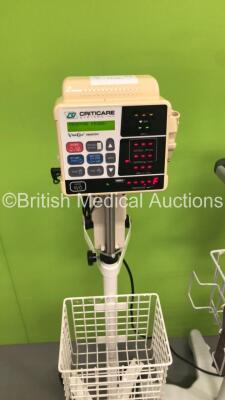 1 x CSI Criticare Vital Care 506DXNT Vital Signs Monitor on Stand and 2 x CSI Criticare ComfortCuff 506N3 Series Vital Signs Monitors on Stands (All Power Up - 1 x Damaged Handle - See Pictures *S/N 211522851 / 300362102 / 213725893* - 3