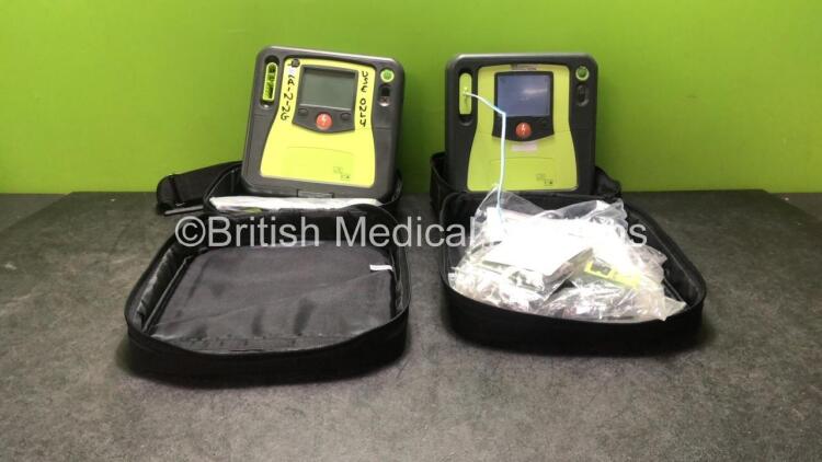 2 x Zoll AED PRO Defibrillators with 2 x Batteries in Carry Bags (Both Power Up with Damage Screens-See Photos))