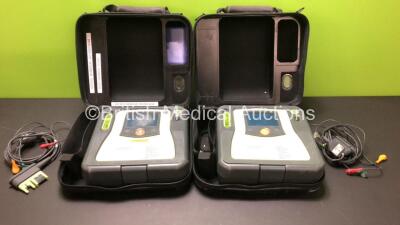 2 x Zoll AED Pro Defibrillators with 2 x Carry Cases, 2 x Electrodes and 1 x Battery (Both Power Up with Screen Damage)