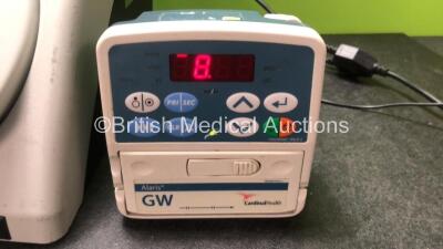 Mixed Lot Including 1 x Ambu+ aScope Monitor with 1 x AC Power Supply (No Power) 1 z ConMed Smoke Evacuator Unit (Powers Up) 1 x Cardinal Health Alaris GW Volumetric Pump (Powers Up with Fault and Alarm-See Photo) - 5