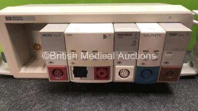 Mixed Lot Including 1 x GE TruSat Oximeter, 3 x Hemocue Glucose 201+ Glucose Analyzers, 2 x Module Racks with 2 x Agilent DRUCK Modules, 2 x Agilent NBP Modules (1 with Missing Cover-See Photo) 2 x EKG/RESP Modules, 2 x SpO2/PLETH Modules and 2 x TEMP Mod - 5