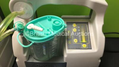 Mixed Lot Including 2 x Oxylitre Suction Units with 1 x Serres Cup and Lid (Both Power Up) and 3 x Cardinal Health Alaris GH Syringe Pumps (All Draw Power with Blank Screens) - 2