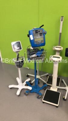 Mixed Lot Including 3 x Blood Pressure Meters on Stands, 2 x Seca Stand on Weighing Scales 1 x Welch Allyn Patient Examination Lamp, 1 x GE Dinamap Pro 300 V2 Vital Signs Monitor on Stand (No Power - Damaged - See Pictures) and 1 x Dignitana Digini C3 Sca - 4