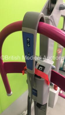 1 x Minstrel Electric Patient Hoist with Controller (Not Power Tested Due to No Battery) and 1 x Arjo Opera Electric Patient Hoist with Battery and Controller (No Power) - 3