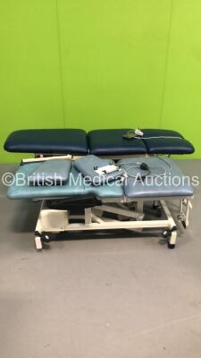 1 x Akron 3 Way Electric Patient Examination Couch with Controller and 1 x Huntleigh Electric Patient Examination Couch with Controller (Both Power Up - Both Marks to Cushions)