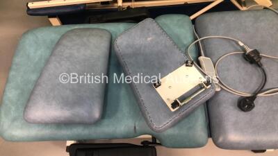 1 x Akron 3 Way Electric Patient Examination Couch with Controller and 1 x Huntleigh Electric Patient Examination Couch with Controller (Both Power Up - Both Marks to Cushions) - 3