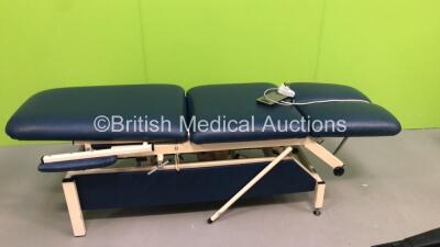 1 x Akron 3 Way Electric Patient Examination Couch with Controller and 1 x Huntleigh Electric Patient Examination Couch with Controller (Both Power Up - Both Marks to Cushions) - 5