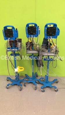 3 x GE ProCare 400 Patient Monitors on Stands with 3 x BP Hoses,2 x SpO2 Finger Sensors and 3 x BP Hoses (All Power Up)