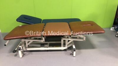 1 x Akron 3 Way Hydraulic Patient Examination Couch and 1 x Akron Hydraulic Patient Examination Couch (Hydraulics Tested Working - Both Have Cuts / Damages to Cushions - See Pictures)