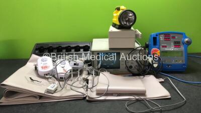 Mixed Lot Including 1 x Motorola Impres Charger (No Power) 3 x Tabs Voice + Model 25023CE Fall Monitors with 5 x Mattresses (Untested Due to Missing Batterie) 1 x Lighthawk Torch (No Power) 1 x Abbott Oximetrix 3 S02 / CO Computer (Powers Up) 1 x Dinamap 