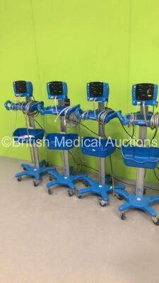 4 x GE Carescape V100 Patient Monitors on Stands with 4 x SpO2 Finger Sensors and 4 x BP Hoses (All Power Up) - 4