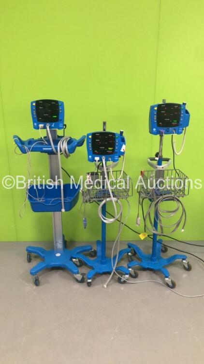 3 x GE Carescape V100 Patient Monitors on Stands with 3 x SpO2 Finger Sensors and 3 x BP Hoses (All Power Up)