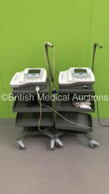 2 x Burdick Atria 6100 ECG Machines on Stands with 2 x 10-Lead ECG Leads (Both Power Up) * SN A6100-001698 / A6100-004165 *